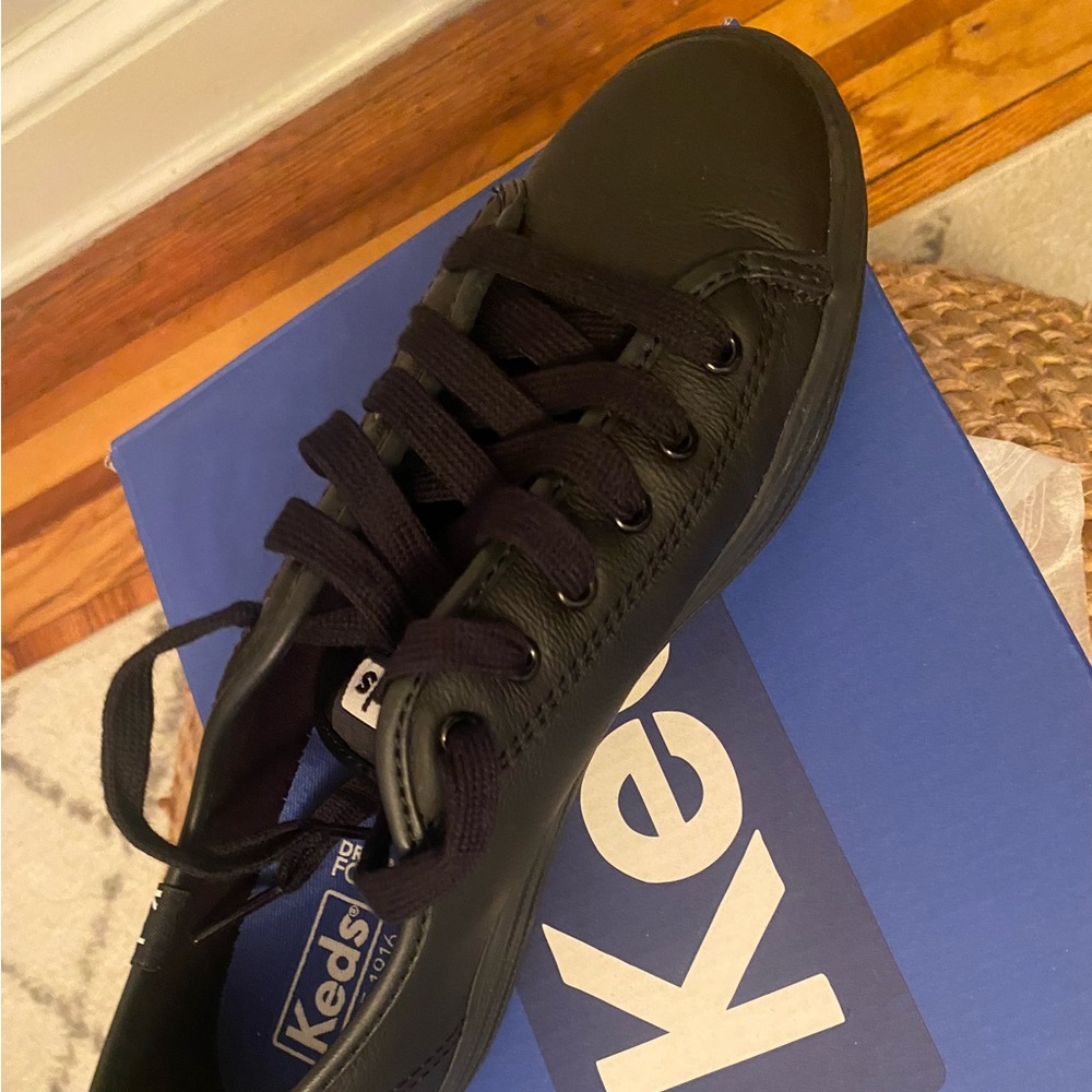 Black leather sneakers. Only worn once.